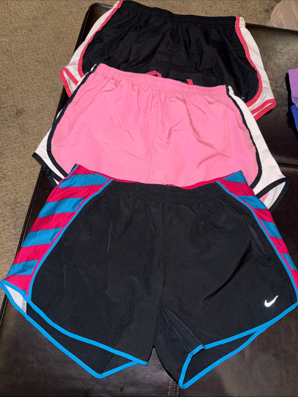 Nike women's Black Athletic Shorts with Blue & Pink Accents.